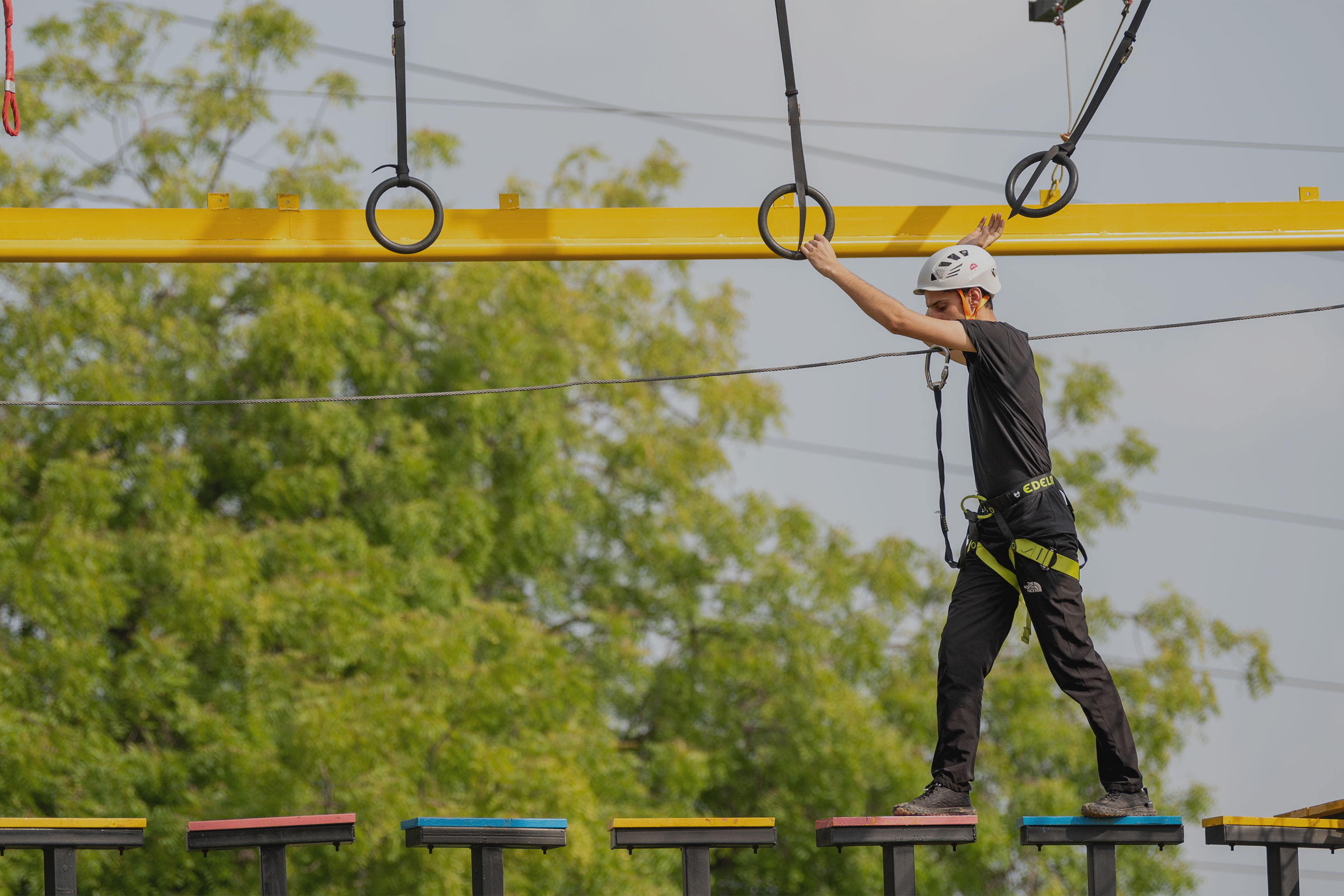 Adventure park signage in evening setting at Roadies Rostel ARC Resort near Ahmedabad