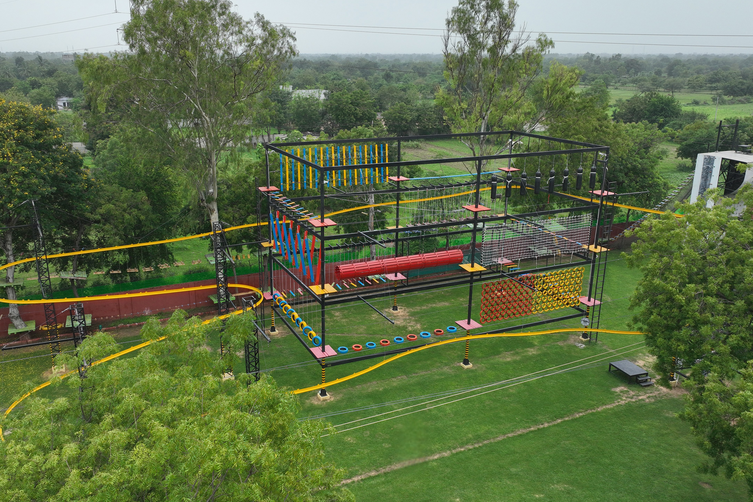 Drone view of lush green adventure park with all rides at Roadies Rostel ARC Resort near Ahmedabad