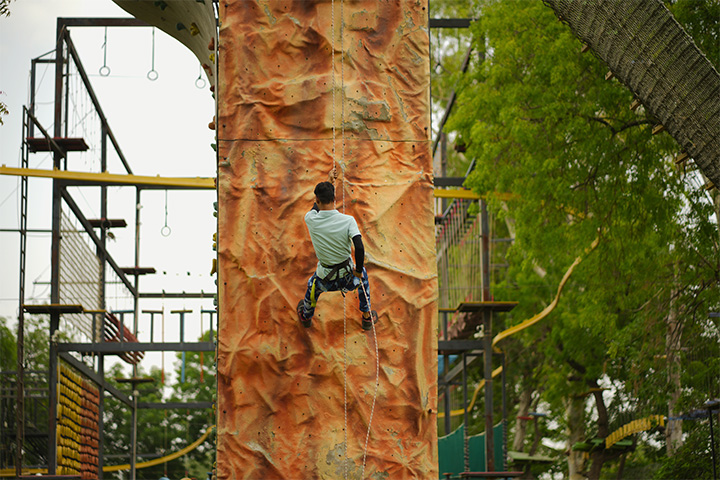 Close-up view of rappelling adventure activity at Roadies Rostel ARC Resort