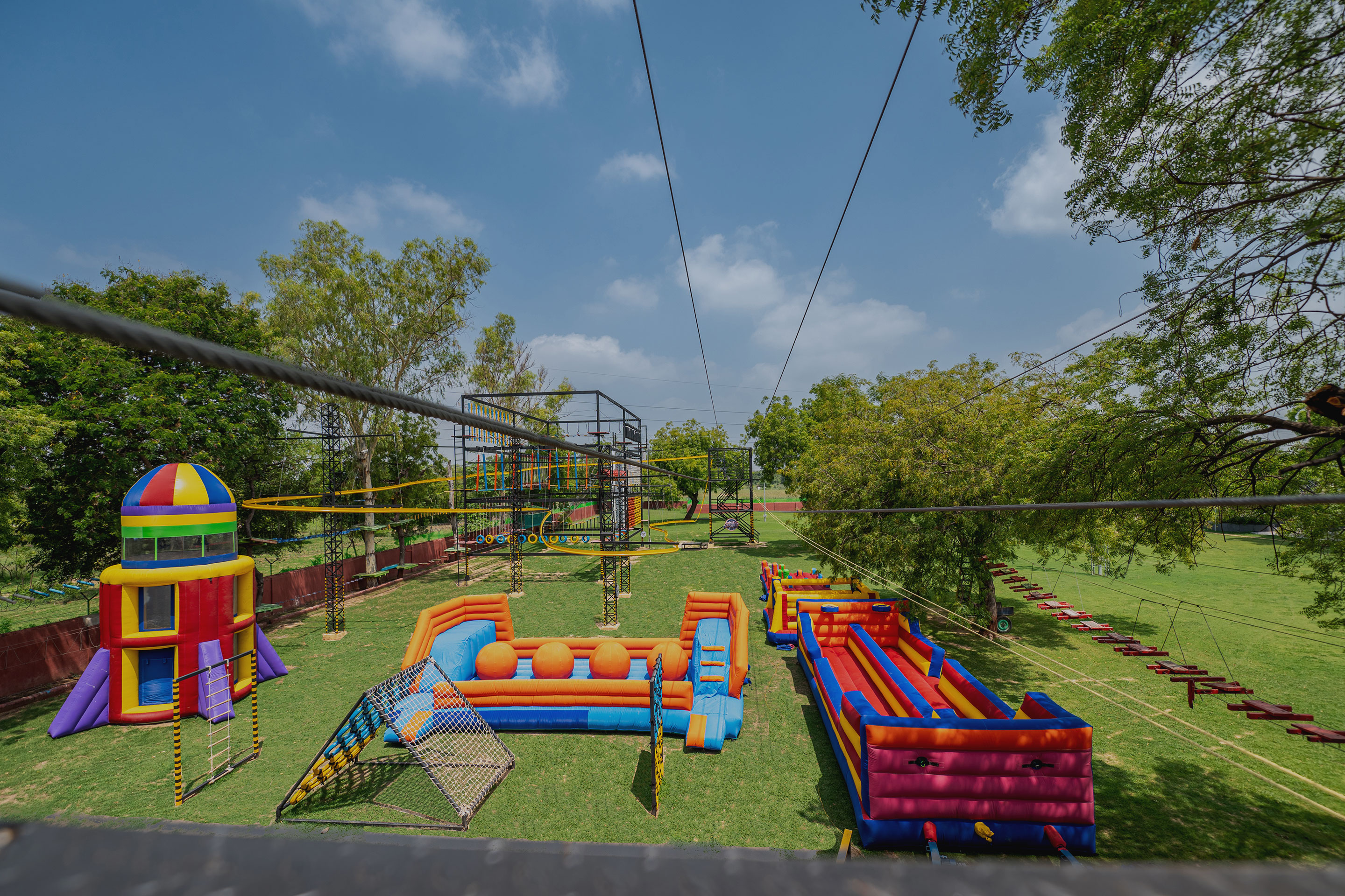 Guest on three-floor rope course at Roadies Rostel ARC Resort adventure park near Ahmedabad