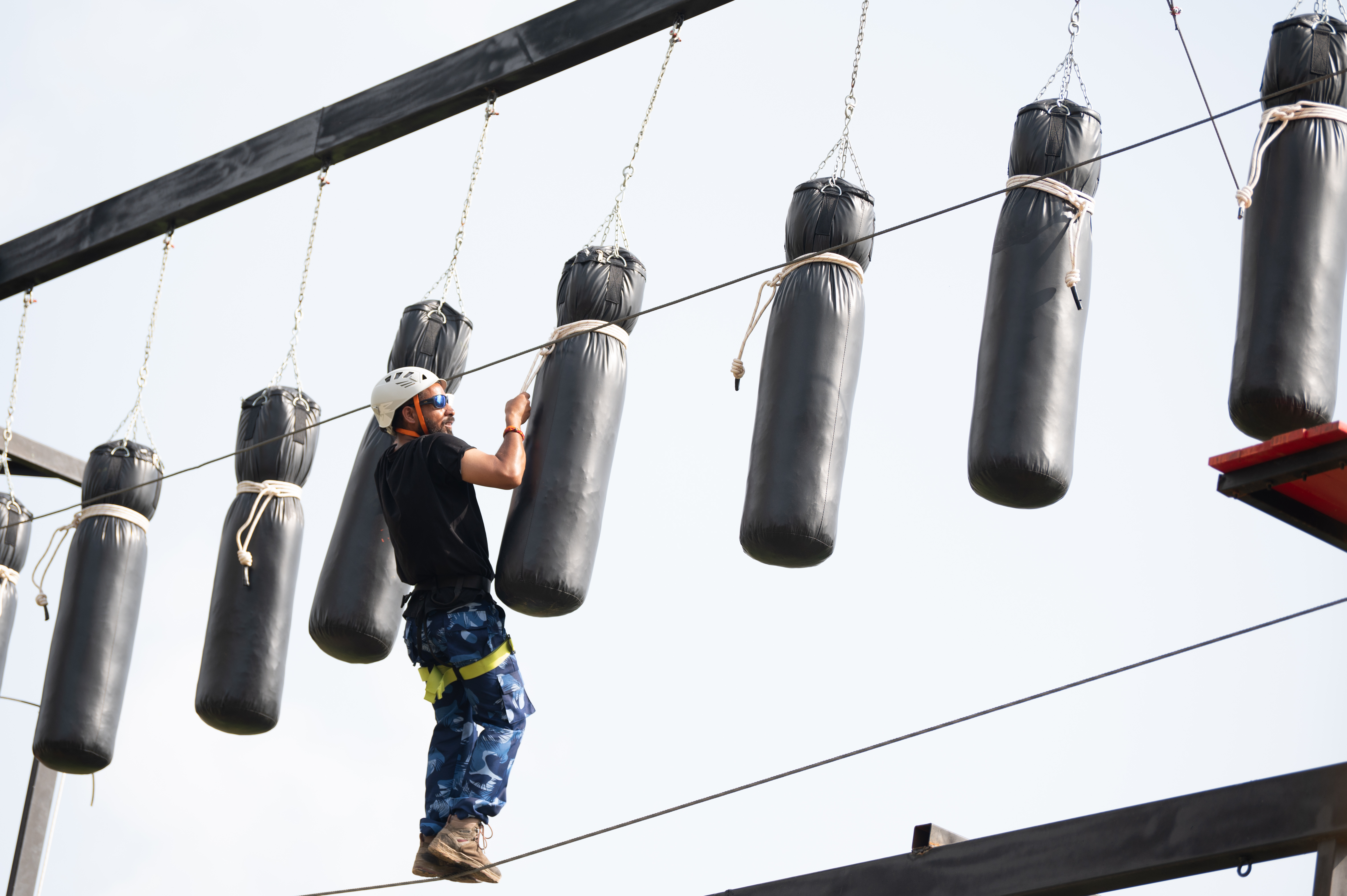 Boxing bags obstacle on adventure rope course at Roadies Rostel ARC Resort near Ahmedabad
