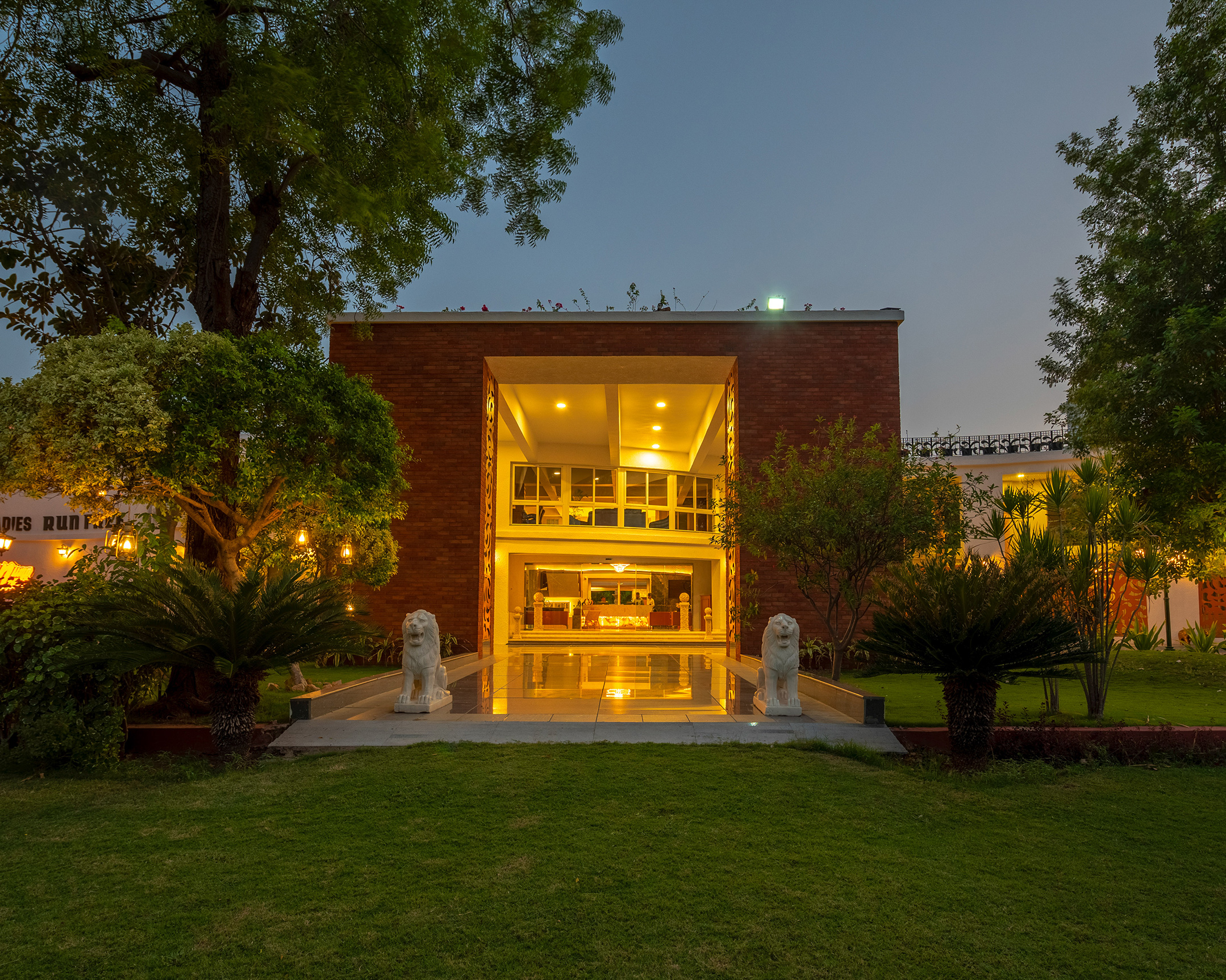 Roadies Rostel ARC Resort entrance at night, ideal celebration venue near Ahmedabad