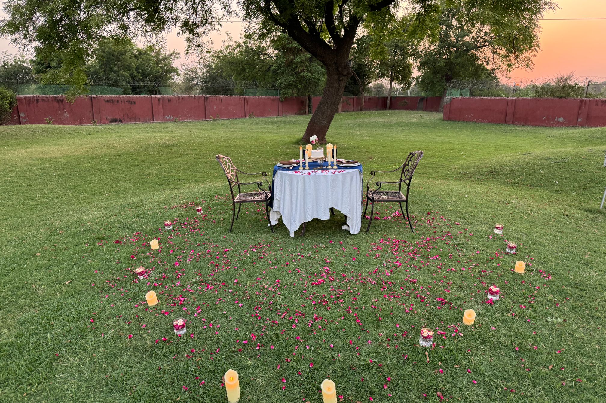 Private candlelight dinner on garden lawn at Roadies Rostel ARC Resort, perfect for romantic getaways