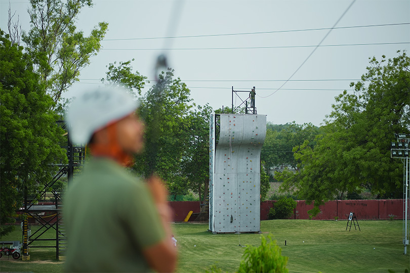 Adventure park view of wall climbing and zipline launch zone near Ahmedabad