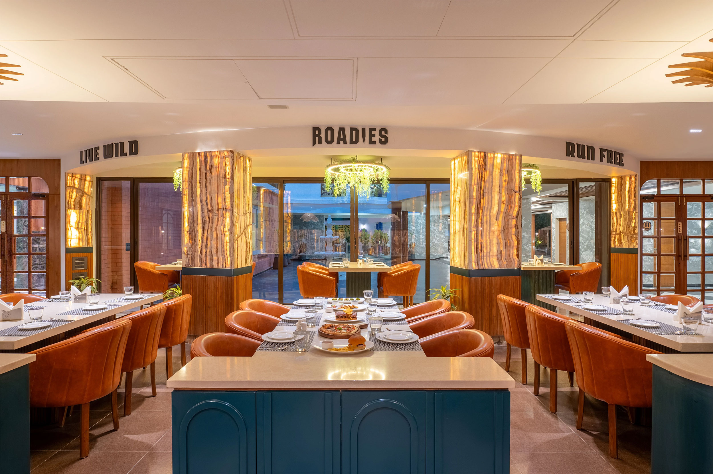 Main view of the resort restaurant at Roadies Rostel ARC, offering a luxury dining experience near Ahmedabad