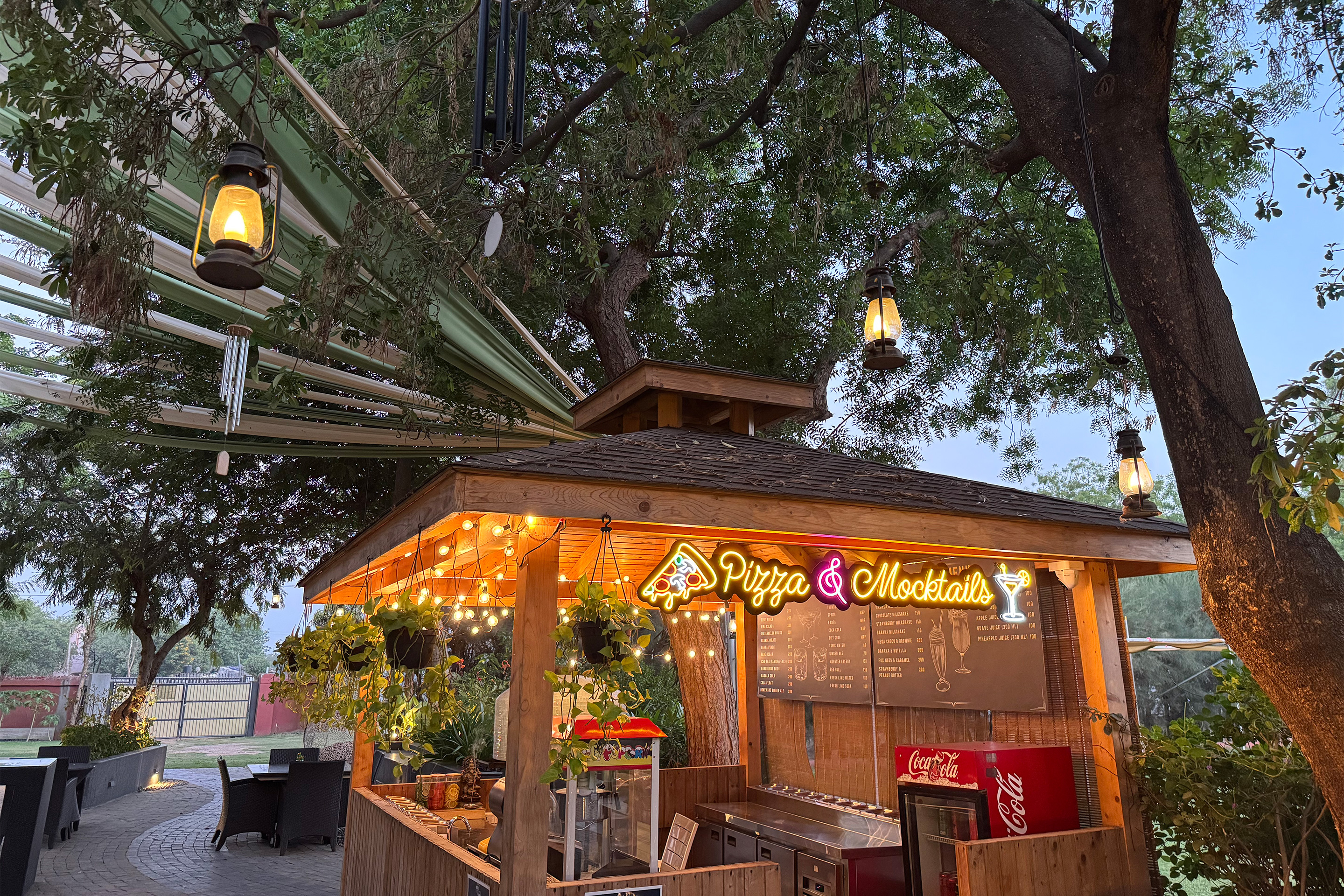 Stylish mocktail bar at Roadies Rostel ARC Resort Ahmedabad, offering handcrafted drinks in a vibrant and relaxed atmosphere.