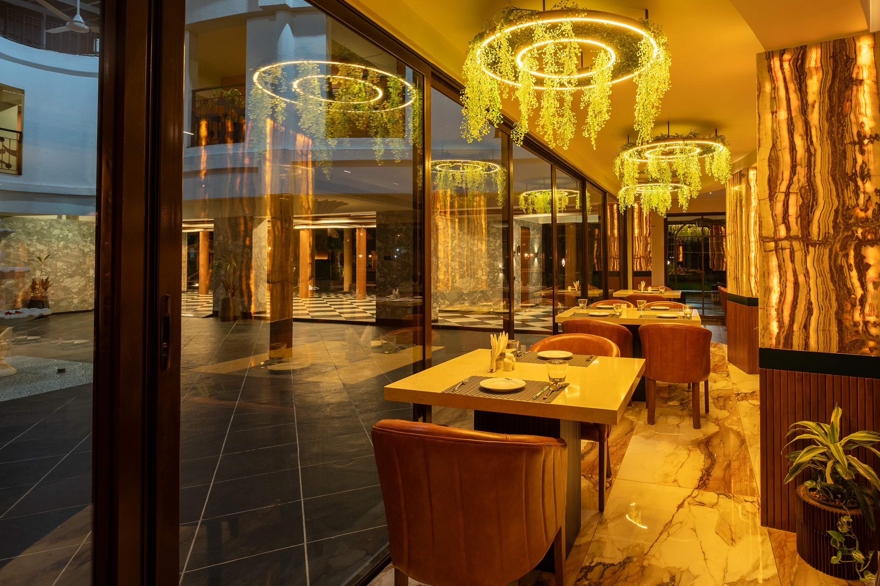 Open-air dining table setup at a luxury resort near Ahmedabad, perfect for group meals and cozy evening dinners.
