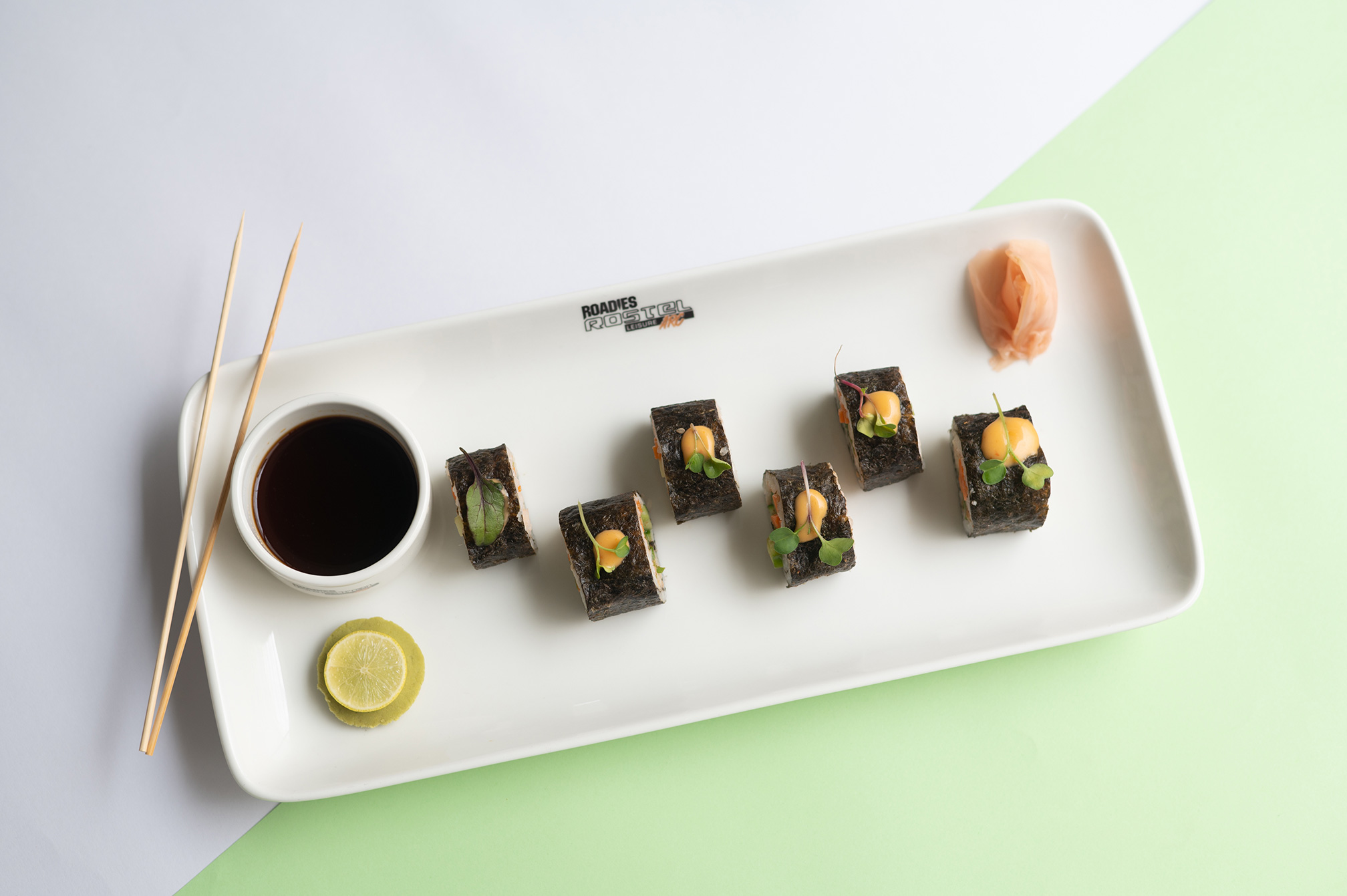 Close-up of freshly prepared sushi served at Samyati restaurant, a top dining destination at Roadies Rostel ARC Resort Ahmedabad.