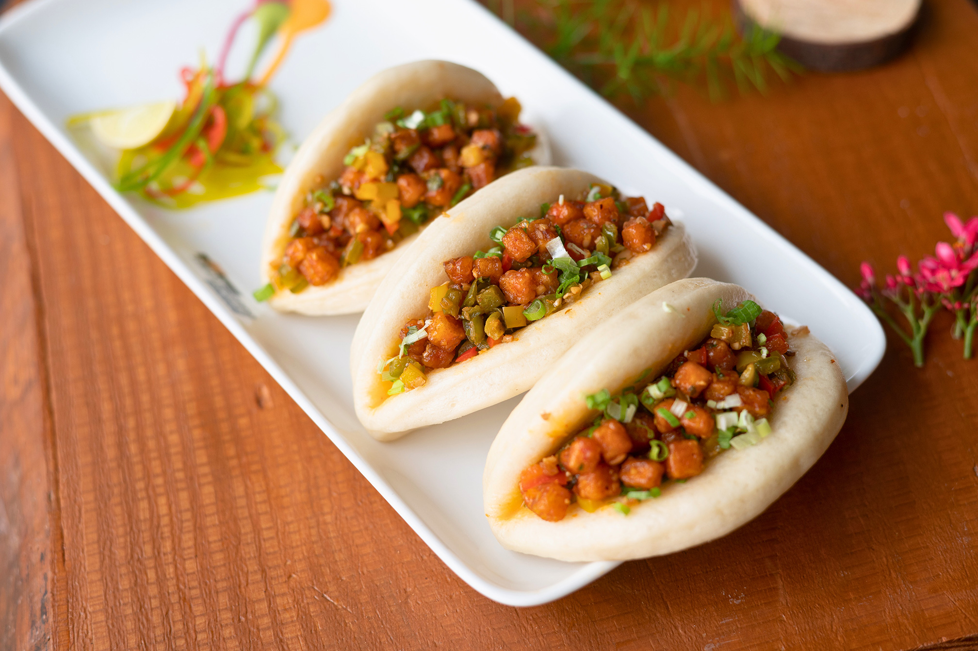 Close-up of delicious steamed bao served at Roadies Rostel ARC Resort Ahmedabad, perfect for food lovers looking for dining near Ahmedabad.