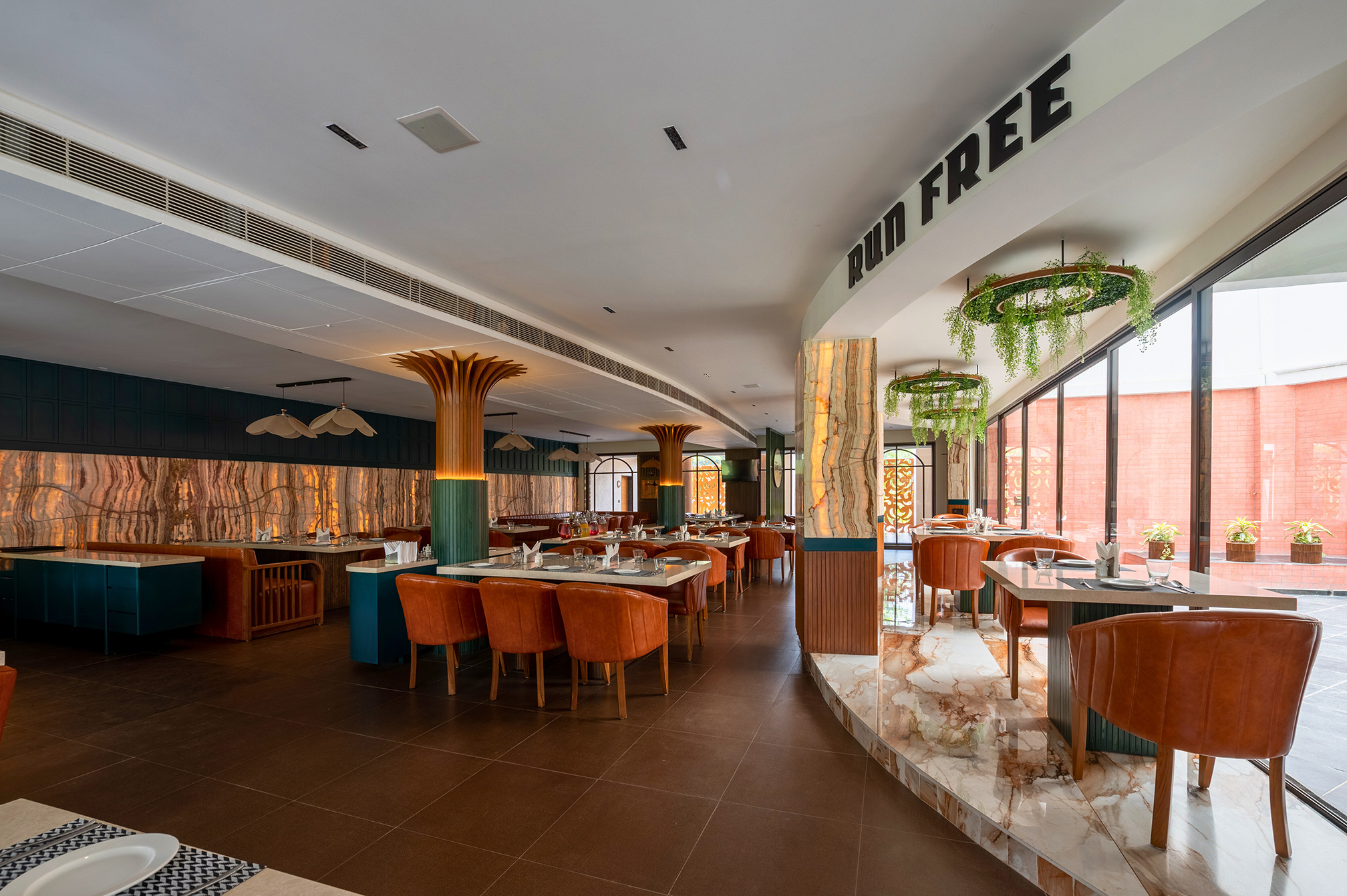 Cozy and elegant interior view of Samyati restaurant at Roadies Rostel ARC Resort Ahmedabad, offering a premium dining ambiance near the city.