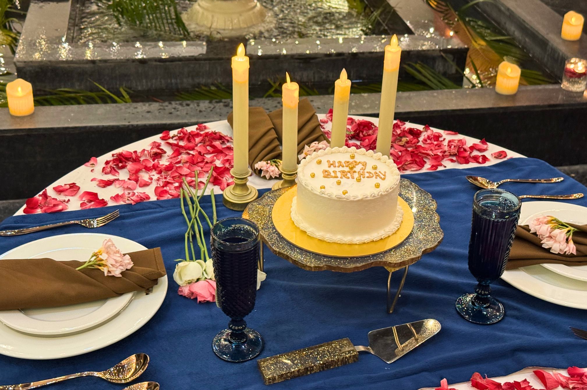 Fountainside celebration setup with floral decor at The Neer, ideal for elegant gatherings at a luxury resort near Ahmedabad.