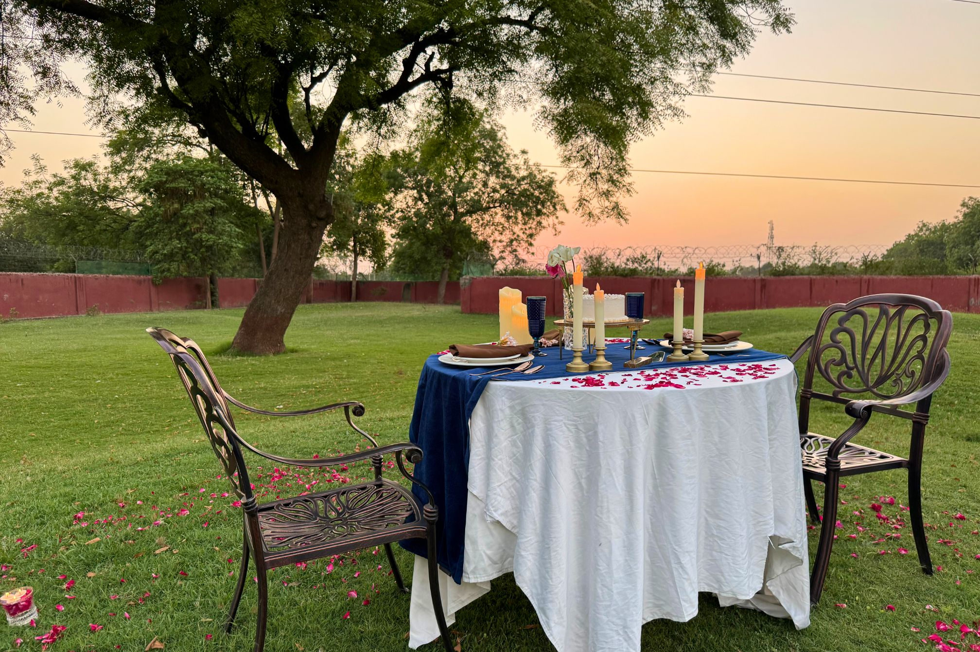 Evening garden dining setup for special moments at Roadies Rostel ARC Resort, surrounded by nature and peaceful vibes.