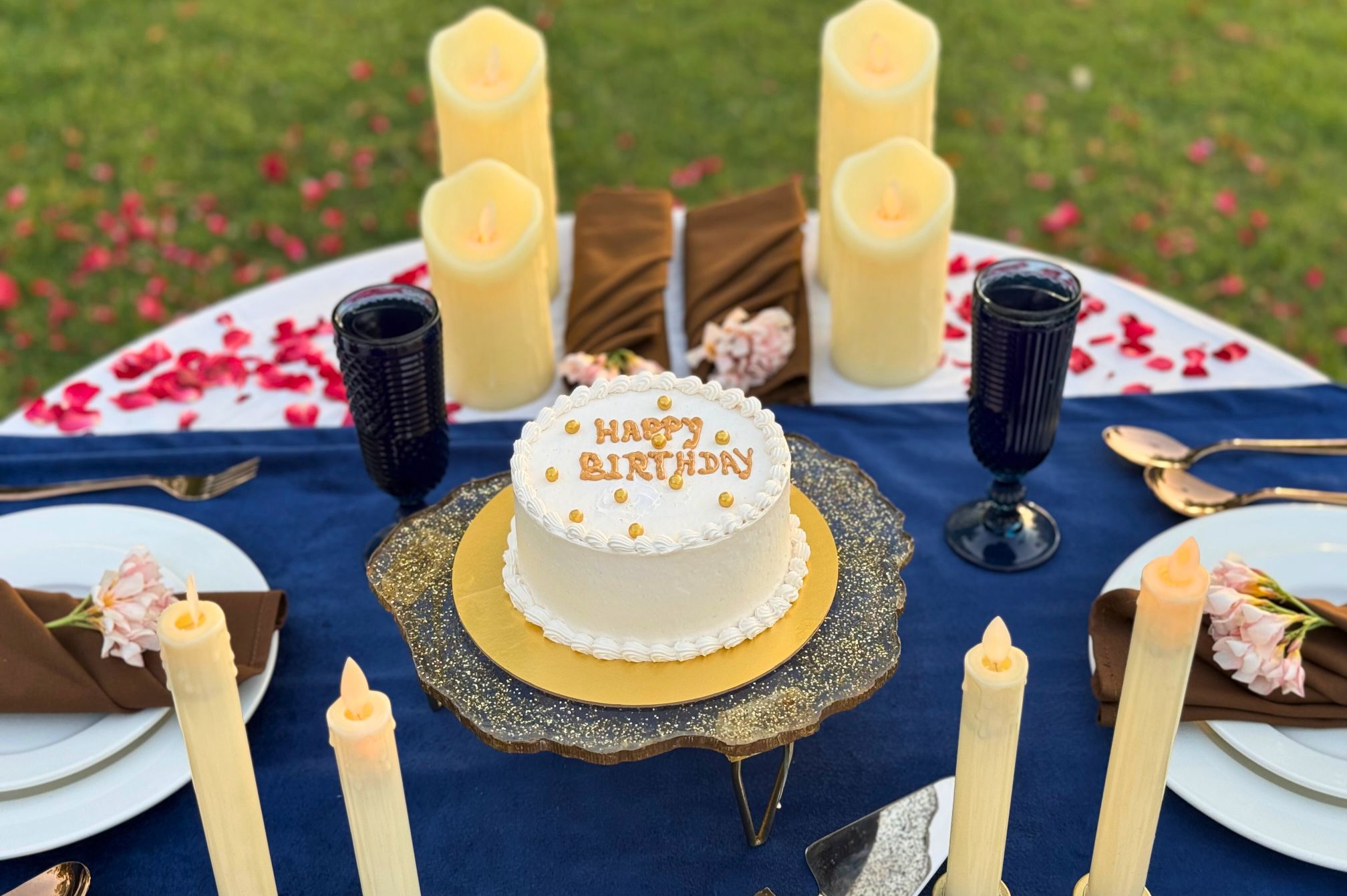 Sunset table setup in the garden at Roadies Rostel ARC Resort Ahmedabad, ideal for romantic celebrations and evening gatherings.