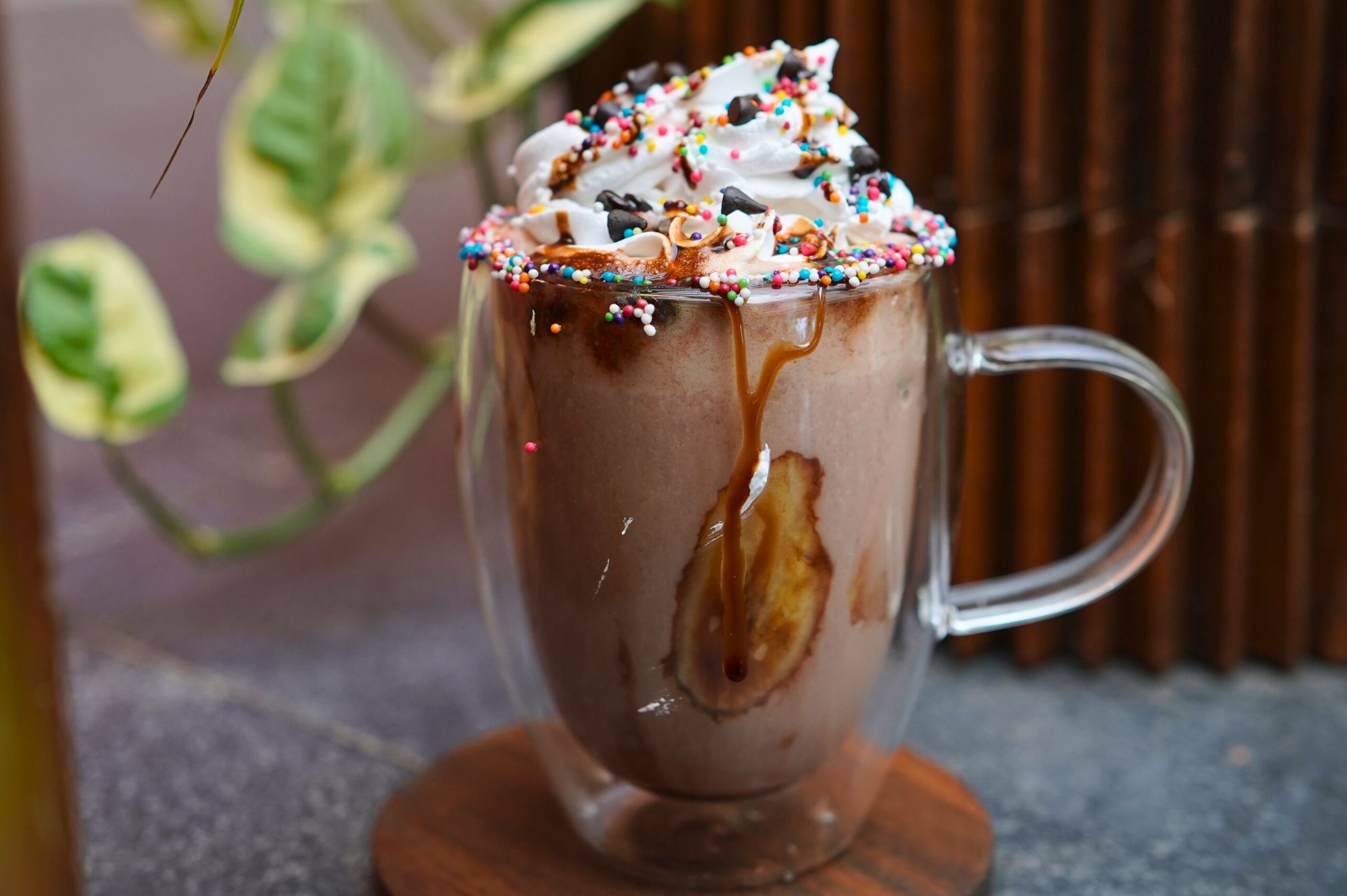 Rich chocolate shake topped with whipped cream, caramel, and rainbow sprinkles at Roadies Rostel