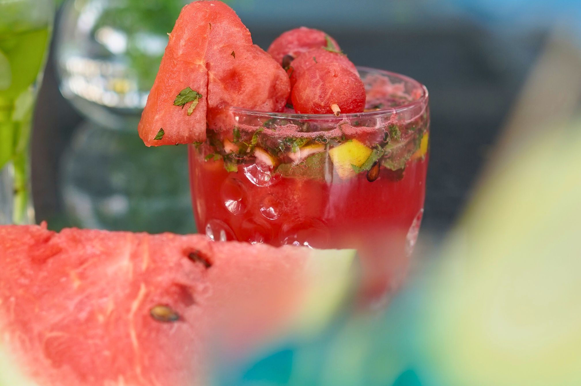 Golden citrus mocktail served chilled on stone floor near the poolside at Roadies Rostel