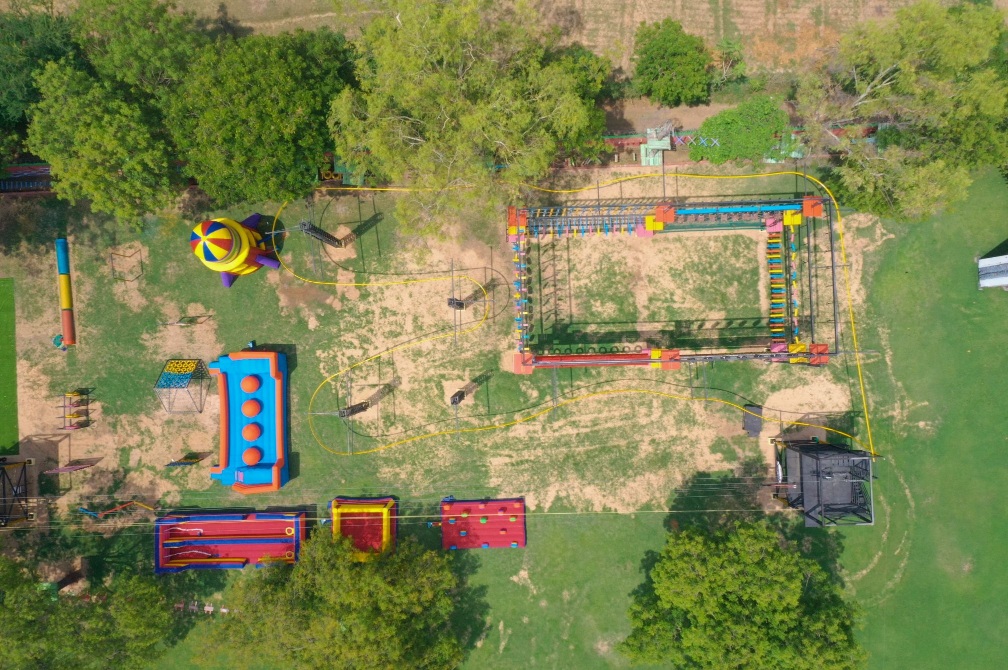 Aerial view of adventure park and inflatable zone at Roadies Rostel ARC Resort near Ahmedabad