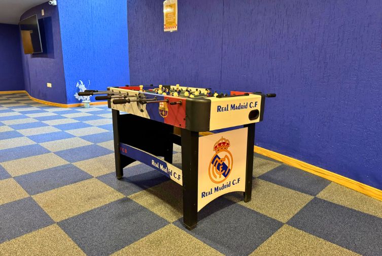 Foosball table game setup in the den area at Roadies Rostel ARC Resort