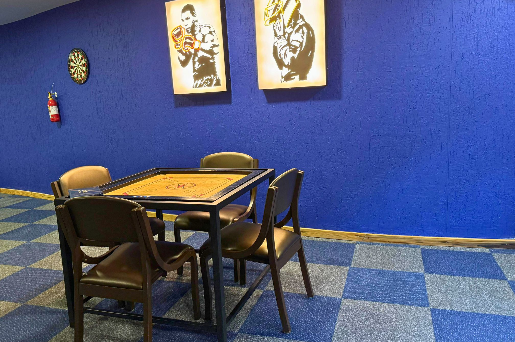 Carrom board and dart board corner in indoor games section