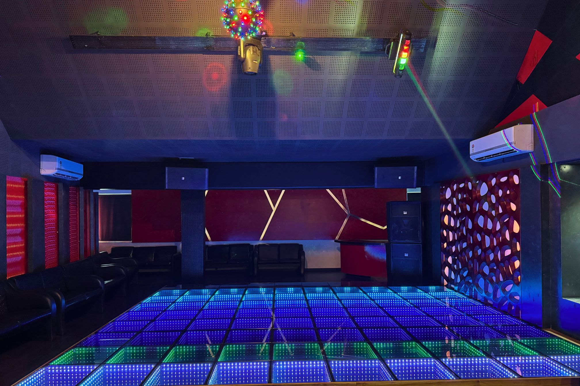 Party-ready discotheque room with disco lights and music vibes at Roadies Rostel near Ahmedabad