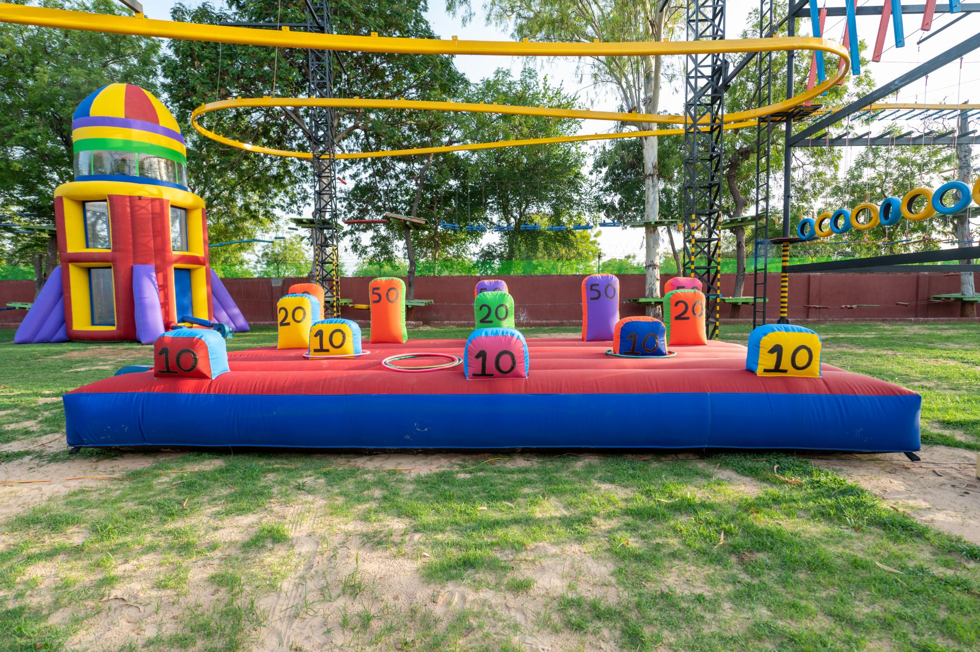 Colorful inflatable ring toss activity in the adventure park, perfect for kids at a one day picnic resort near Ahmedabad.