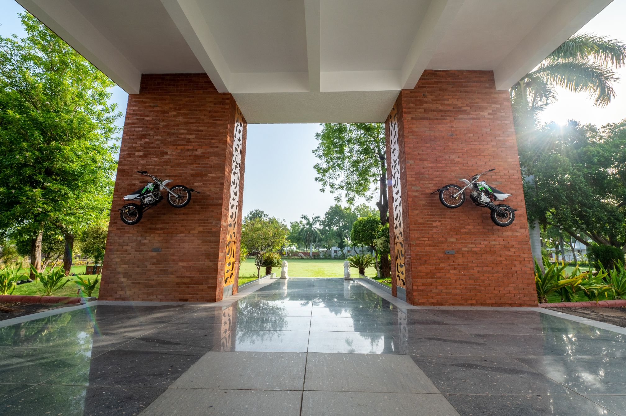 Grand entry gate with bike décor at Roadies Rostel ARC Resort Ahmedabad