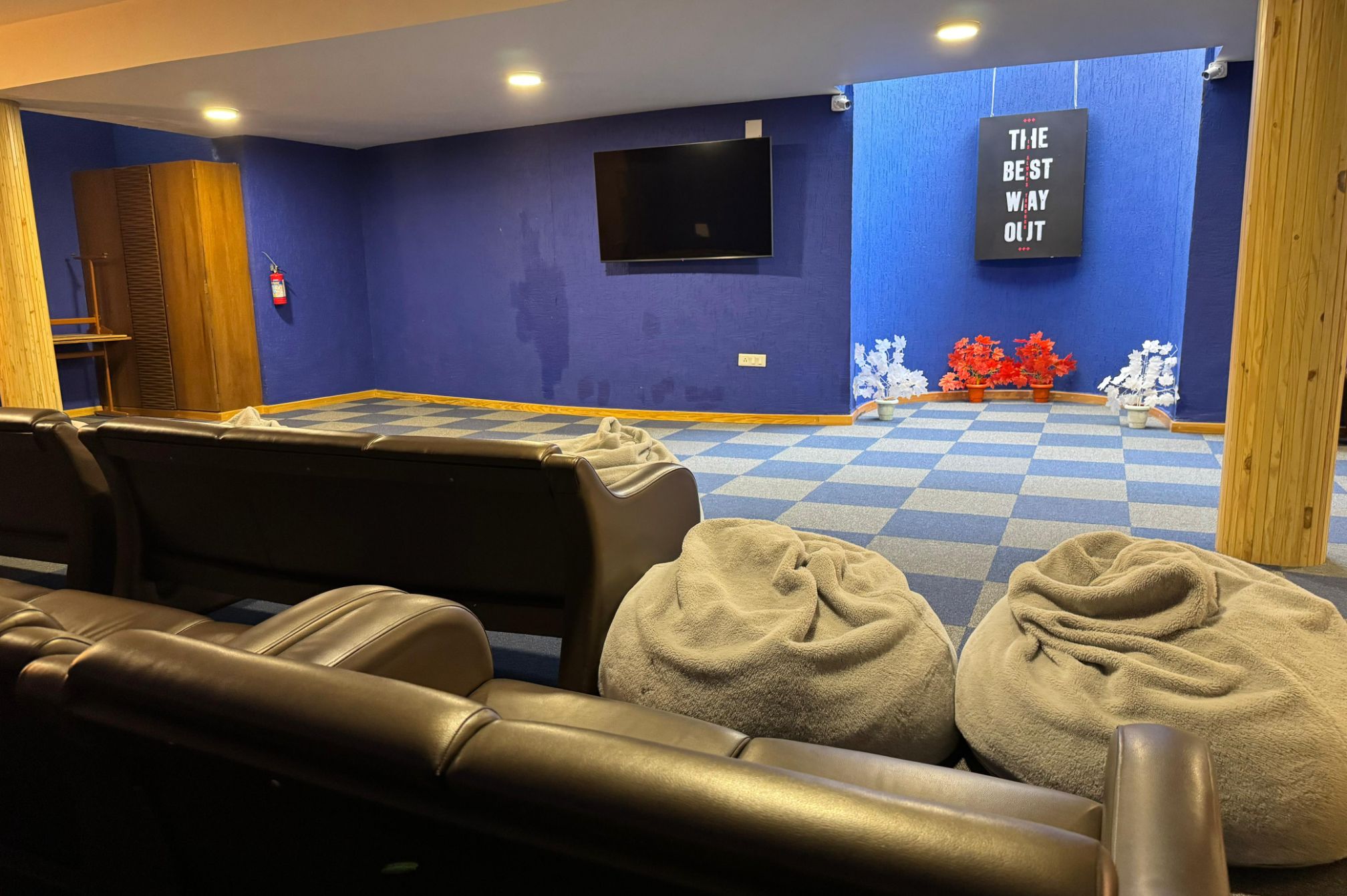 Cozy indoor theatre room with bean bags at Roadies Rostel ARC Resort