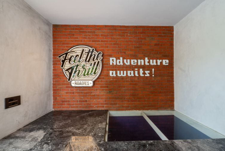Feel the Thrill adventure wall signage at Roadies Rostel ARC Resort