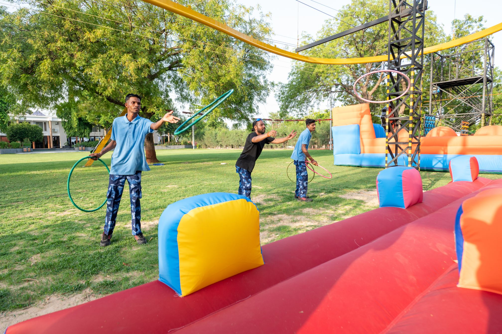 Guests enjoying ring toss inflatable game at Roadies Rostel Adventure Park, a fun one day picnic activity near Ahmedabad.