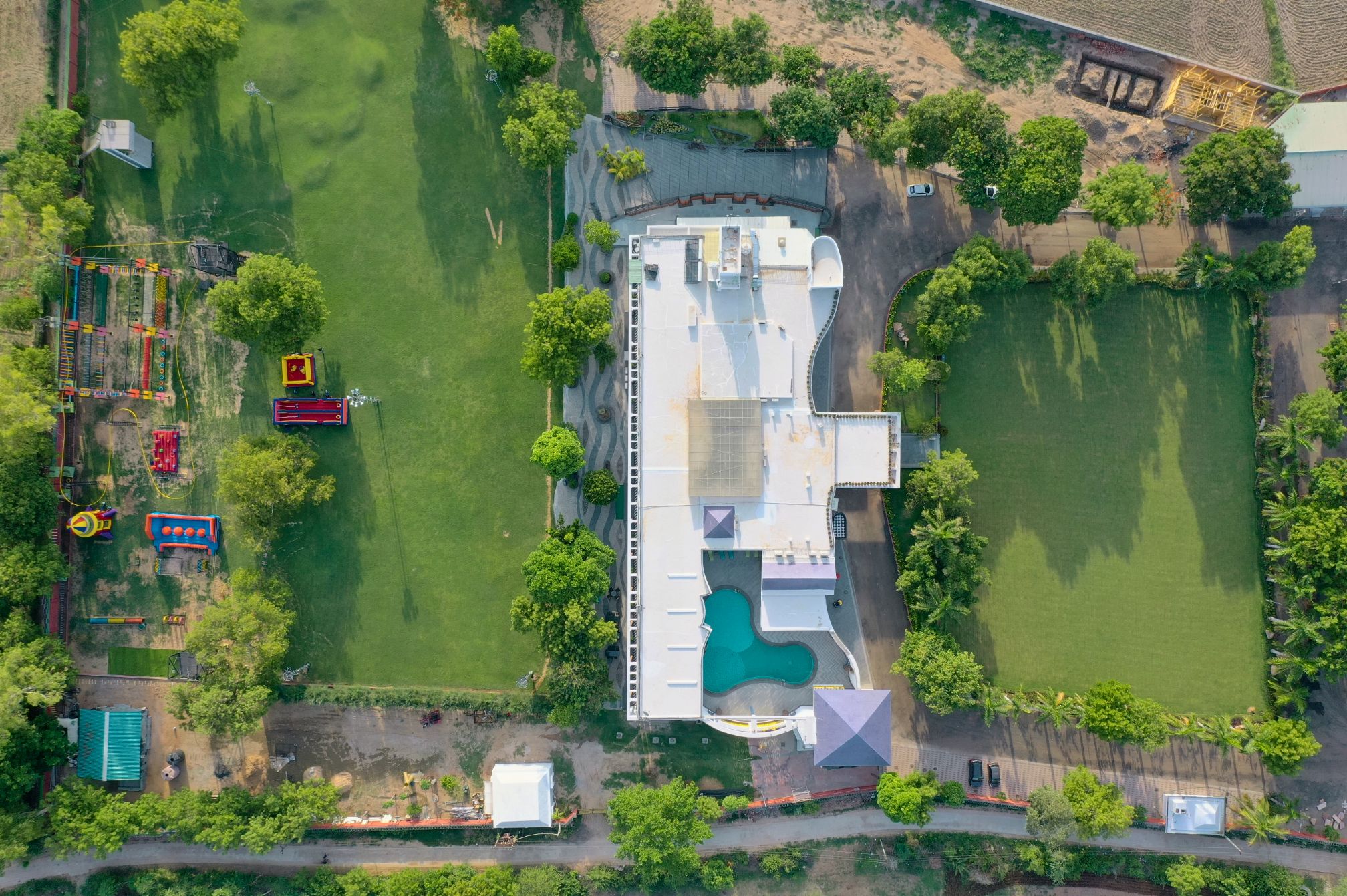 Aerial top view of Roadies Rostel ARC Resort showing pool, lawns and adventure park near Ahmedabad