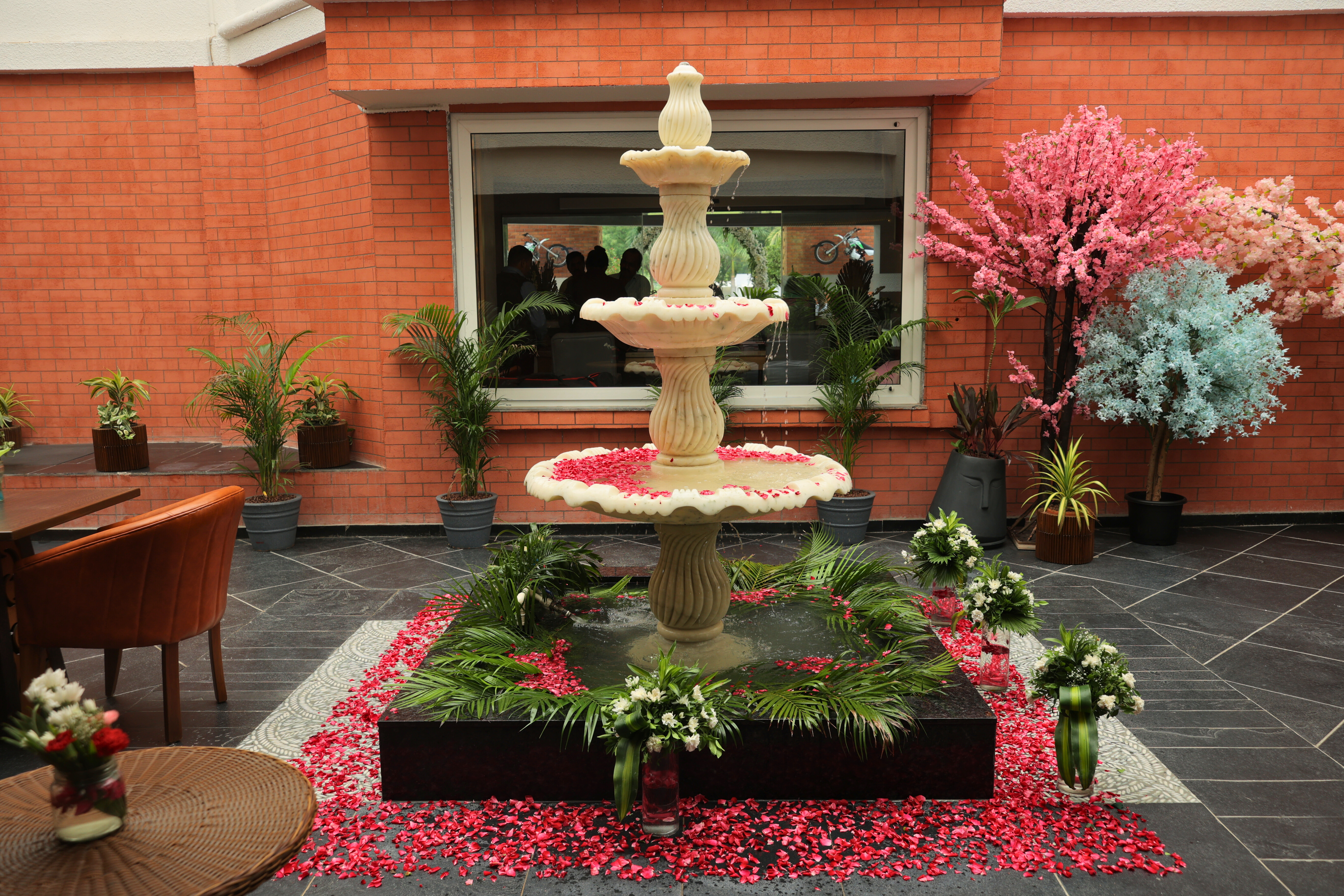 Ornate floral fountain courtyard with romantic setup and seasonal décor at Roadies Rostel ARC Resort near Ahmedabad