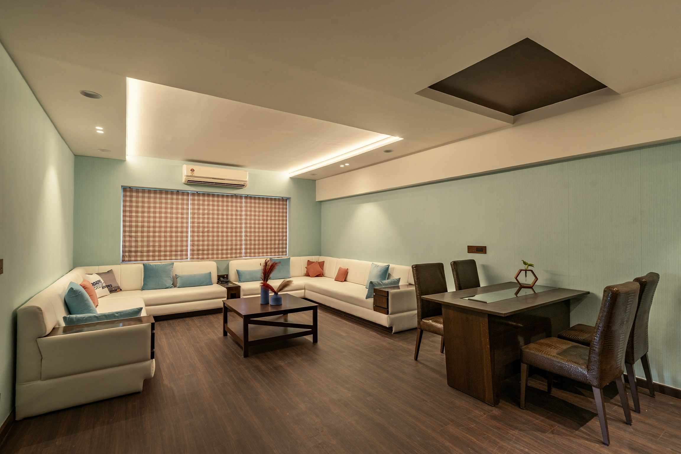 Spacious living room with plush sofa in the Family Suite at Roadies Rostel ARC Resort